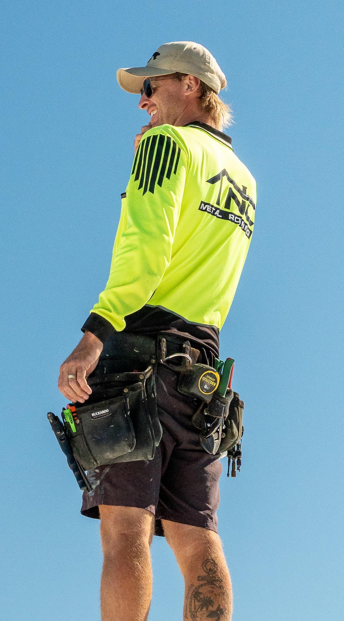 Tanner from TNC Metal Roofing in hi-vis on site